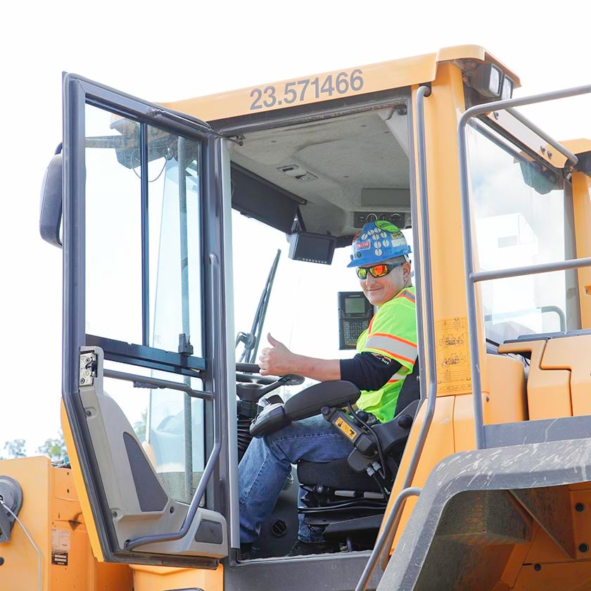 person giving thumbs from inside machinery